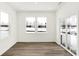 Cozy sun room with large windows, sliding glass doors, wood-look floors, and ample natural light at 4390 Red Pine Dr, Bargersville, IN 46106