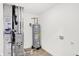 Utility room with furnace, water heater, tile floors, and hookups for a washer and dryer, essential for convenience at 4390 Red Pine Dr, Bargersville, IN 46106