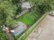 Aerial shot highlighting a fenced backyard with a shed, green space, and mature tree coverage at 4926 Crittenden Ave, Indianapolis, IN 46205