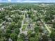 Aerial view of homes and a church with mature trees, providing a sense of community at 4926 Crittenden Ave, Indianapolis, IN 46205
