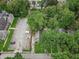 Overhead view showcasing a residential area with lush greenery and a white van parked nearby at 4926 Crittenden Ave, Indianapolis, IN 46205