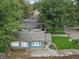 Aerial shot featuring a well-maintained home with green lawns, mature trees, and a quiet residential street at 4926 Crittenden Ave, Indianapolis, IN 46205