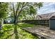 Spacious backyard with lush green grass, a shed, privacy fence and room for outdoor activities at 4926 Crittenden Ave, Indianapolis, IN 46205
