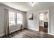 Inviting living room featuring hardwood floors, neutral walls and bright natural light at 4926 Crittenden Ave, Indianapolis, IN 46205
