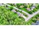 Scenic aerial shot of a luxury home nestled among verdant trees in a suburban neighborhood at 5268 Woodfield Dr N, Carmel, IN 46033