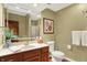 Well-lit bathroom with a large mirror, vanity with sink, and decorative accents adding a touch of elegance at 5268 Woodfield Dr N, Carmel, IN 46033