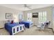 Charming bedroom with carpet, two beds, shutters, and unique wall art at 5268 Woodfield Dr N, Carmel, IN 46033