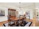 Traditional dining room with hardwood floors, chandelier, and classic furnishings at 5268 Woodfield Dr N, Carmel, IN 46033