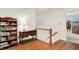 Well-lit hallway featuring hardwood floors and access to a walk-in closet at 5268 Woodfield Dr N, Carmel, IN 46033