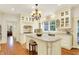 Well-lit kitchen with granite countertops and hardwood floors at 5268 Woodfield Dr N, Carmel, IN 46033