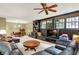 Spacious living area with a table and seating, built-in shelving, and entertainment center at 5268 Woodfield Dr N, Carmel, IN 46033