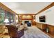 Comfortable living area with wood trim, fireplace, and plush seating at 5268 Woodfield Dr N, Carmel, IN 46033