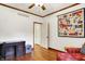Office space with hardwood floors, desk, and a quilt hanging on the wall at 5268 Woodfield Dr N, Carmel, IN 46033