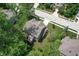 Aerial view of a home showcasing its backyard, surrounding trees, and neighborhood layout at 527 Macintosh Ln, Danville, IN 46122
