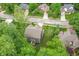 Aerial view of a two-story home with an attached garage and surrounding lush greenery in a neighborhood setting at 527 Macintosh Ln, Danville, IN 46122
