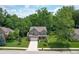 Aerial view of a charming home showcasing its manicured lawn, landscaping, and neighborhood at 527 Macintosh Ln, Danville, IN 46122