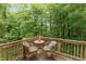 Secluded back deck with table and chairs offering stunning views of the surrounding lush greenery at 527 Macintosh Ln, Danville, IN 46122