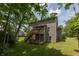 Exterior view featuring a two-story deck in the backyard of a home, with lush greenery and trees visible at 527 Macintosh Ln, Danville, IN 46122
