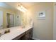 Cozy bathroom featuring a vanity, mirror, modern fixtures, and ample counter space at 527 Macintosh Ln, Danville, IN 46122