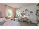 Stylized bedroom features a unique swing chair, a writing desk and calming decor at 527 Macintosh Ln, Danville, IN 46122