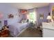 Comfortable bedroom featuring lavender walls, cozy single bed, and a decorative hammock with plush toys at 527 Macintosh Ln, Danville, IN 46122