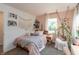 Comfortable bedroom features soft pink walls, natural light, and a cozy swing chair at 527 Macintosh Ln, Danville, IN 46122