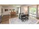 Open dining area features stylish decor, an adjacent game room, and access to the outdoor patio at 527 Macintosh Ln, Danville, IN 46122