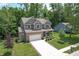 Attractive two-story home with attached two-car garage, long driveway, and beautifully landscaped front yard at 527 Macintosh Ln, Danville, IN 46122