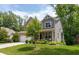 Charming two-story home featuring a well-manicured lawn, beautiful landscaping, and a welcoming front porch at 527 Macintosh Ln, Danville, IN 46122