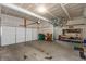 Spacious garage with ample storage, overhead racks for bicycles, and a workbench for projects at 527 Macintosh Ln, Danville, IN 46122