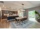 Spacious kitchen with an island, modern appliances, and a dining area with access to the outdoor deck at 527 Macintosh Ln, Danville, IN 46122