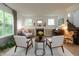 Bright and airy living room featuring a fireplace, piano, and comfortable seating arrangement at 527 Macintosh Ln, Danville, IN 46122