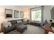 Comfortable living room featuring a plush gray sectional sofa, natural light, and stylish decor at 527 Macintosh Ln, Danville, IN 46122