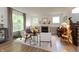 Inviting living room with hardwood floors, fireplace, large windows and neutral color scheme with stylish furnishings at 527 Macintosh Ln, Danville, IN 46122