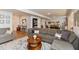 Spacious living room with a large sectional sofa, area rug, and stylish decor at 527 Macintosh Ln, Danville, IN 46122