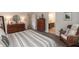 Spacious main bedroom showcasing a comfortable bed, wood furniture, and a tranquil view at 527 Macintosh Ln, Danville, IN 46122