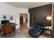 Home office featuring a desk and accent wall, offering a quiet workspace with a comfortable chair and ottoman at 527 Macintosh Ln, Danville, IN 46122
