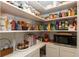 Walk-in pantry featuring ample shelving and storage space for food and kitchen essentials at 527 Macintosh Ln, Danville, IN 46122