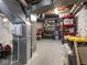 Utility basement with a humidifier, painted walls, and storage shelving with plastic storage bins at 5342 Central Ave, Indianapolis, IN 46220