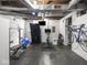 Basement with painted walls, exposed ceiling and home gym equipment at 5342 Central Ave, Indianapolis, IN 46220