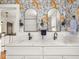 Stylish bathroom featuring double sink vanity, arched mirrors, and decorative wallpaper at 5342 Central Ave, Indianapolis, IN 46220