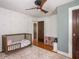 Stylish bedroom with light-colored walls, hardwood flooring and soft pink rug at 5342 Central Ave, Indianapolis, IN 46220