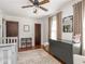 Bright bedroom with hardwood floors, dresser, and a charming area rug at 5342 Central Ave, Indianapolis, IN 46220
