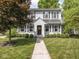 Charming two-story home with a well-manicured lawn and a symmetrical facade with classic shutters at 5342 Central Ave, Indianapolis, IN 46220