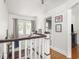 Bright hallway with natural light, hardwood floors, and neutral tones creating a welcoming transition between rooms at 5342 Central Ave, Indianapolis, IN 46220