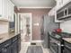 This kitchen features granite countertops, stainless steel appliances, and stylish cabinets and backsplash at 5342 Central Ave, Indianapolis, IN 46220