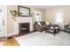 Inviting living room featuring a fireplace, neutral-toned walls, and comfortable seating arrangements at 5342 Central Ave, Indianapolis, IN 46220