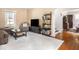 Inviting living room with neutral tones, classic furniture, and hardwood floors provides a comfortable living space at 5342 Central Ave, Indianapolis, IN 46220