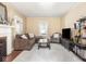 Inviting living room featuring a fireplace, neutral-toned walls, and comfortable seating arrangements at 5342 Central Ave, Indianapolis, IN 46220