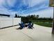 Back patio has patio furniture, privacy fence, and lush lawn at 5379 Marigold Dr, Plainfield, IN 46168
